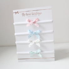 Load image into Gallery viewer, Floral hand tied ribbon bows