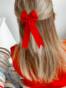 Large red tail pinch ribbon bows