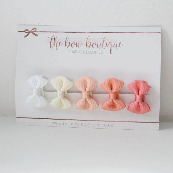 My first peaches mini pinch bows I clips or bobbles