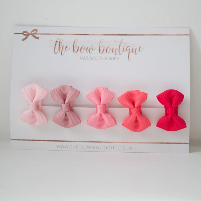 My first pinks mini pinch bows I clips or bobbles
