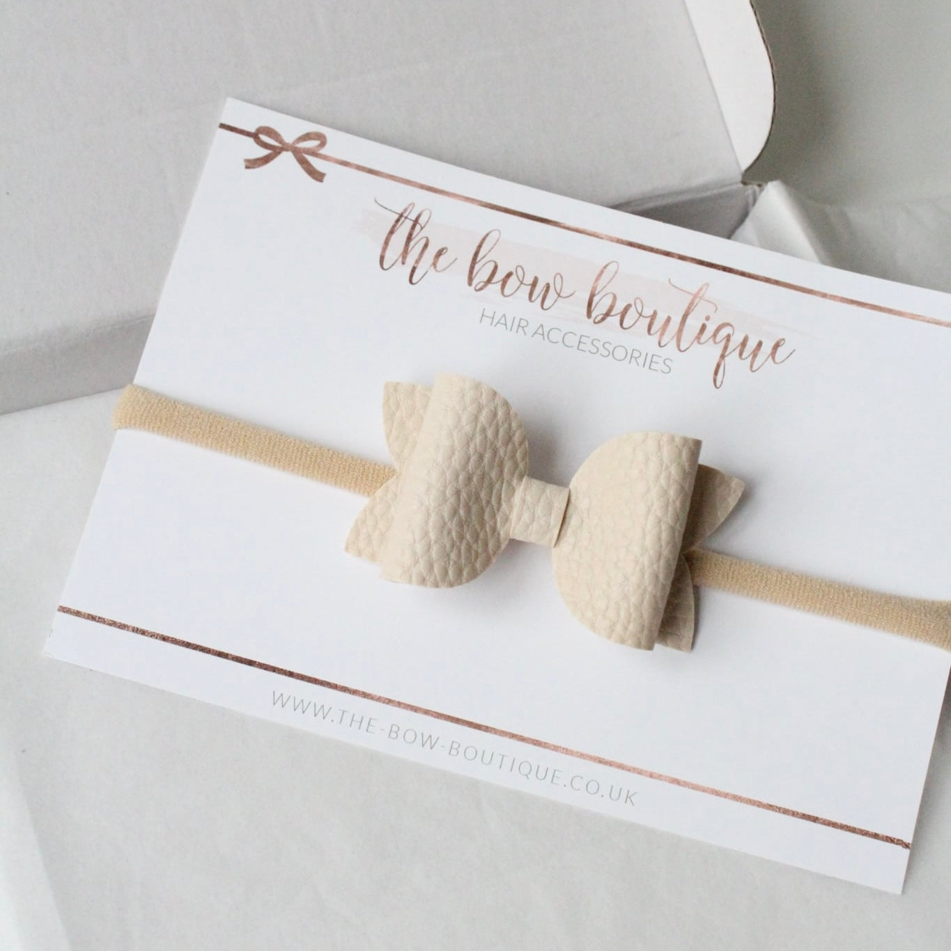 Nude leather look bows