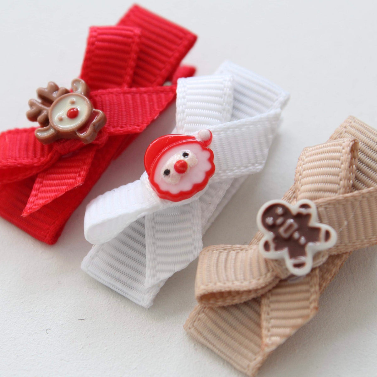 My first christmas bow clips
