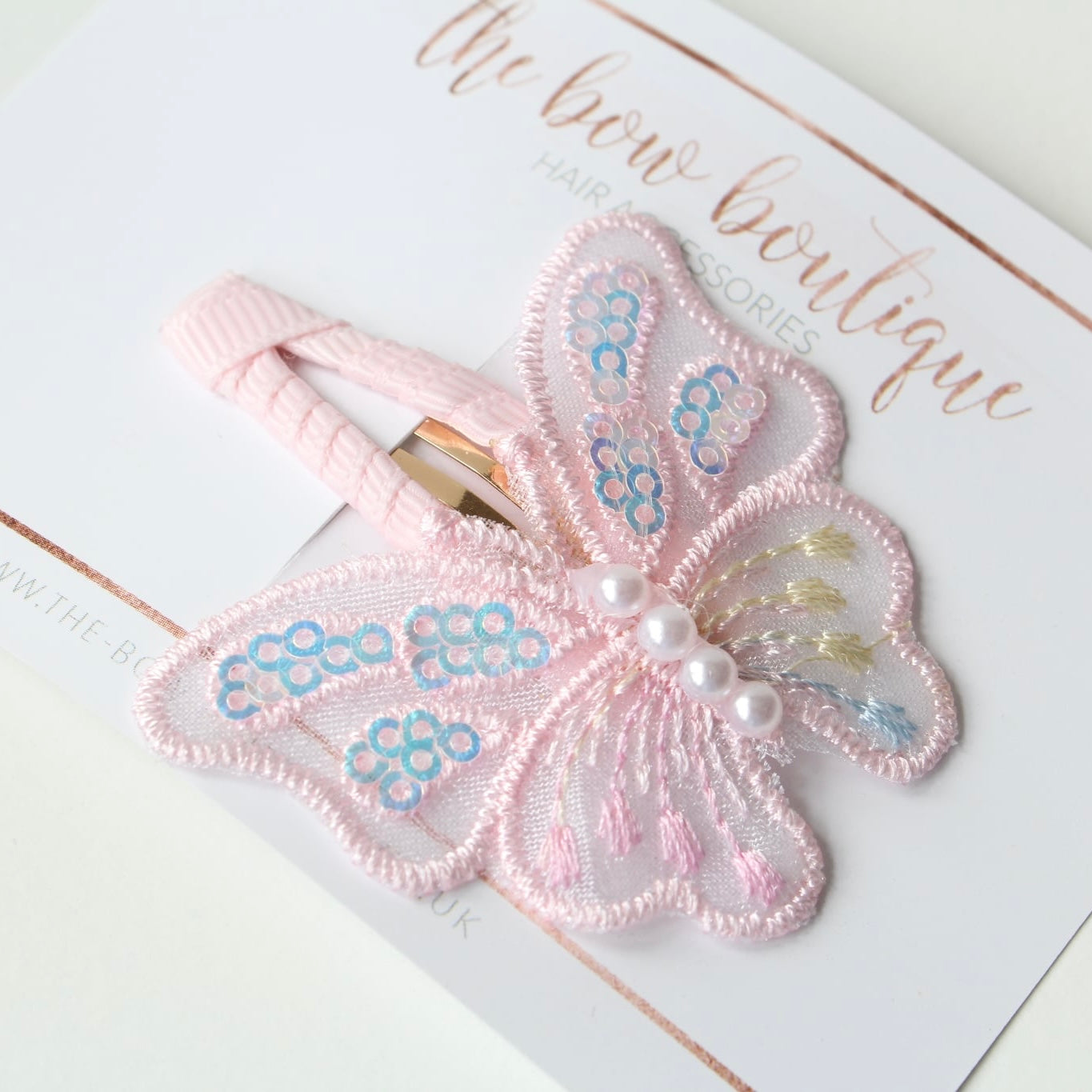 Light pink iridescent butterfly snappy clip