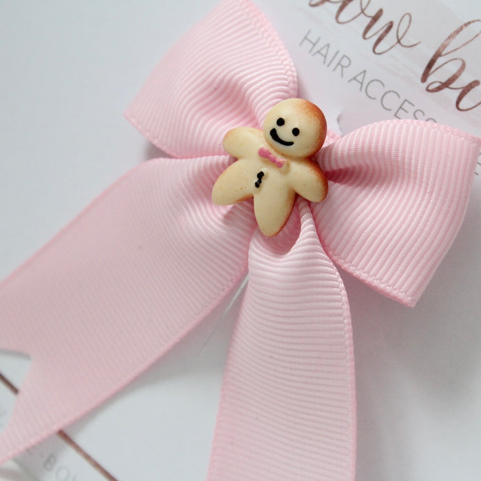 Pink gingerbread man ribbon bow