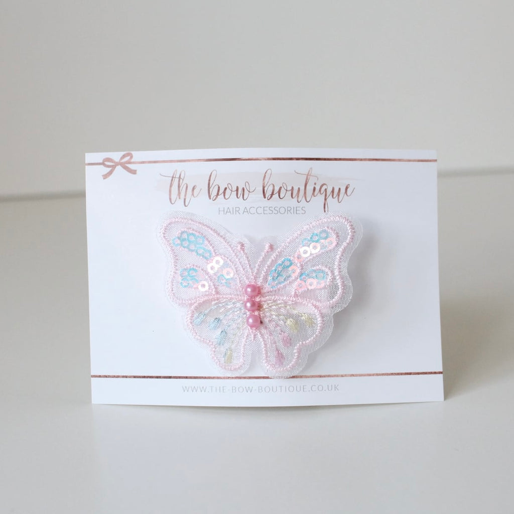 Light pink iridescent butterfly clip