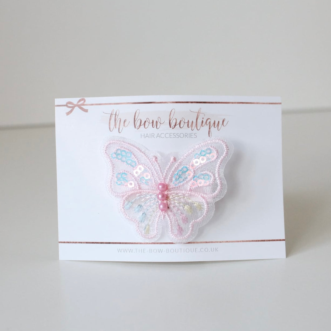 Pink iridescent butterfly clip