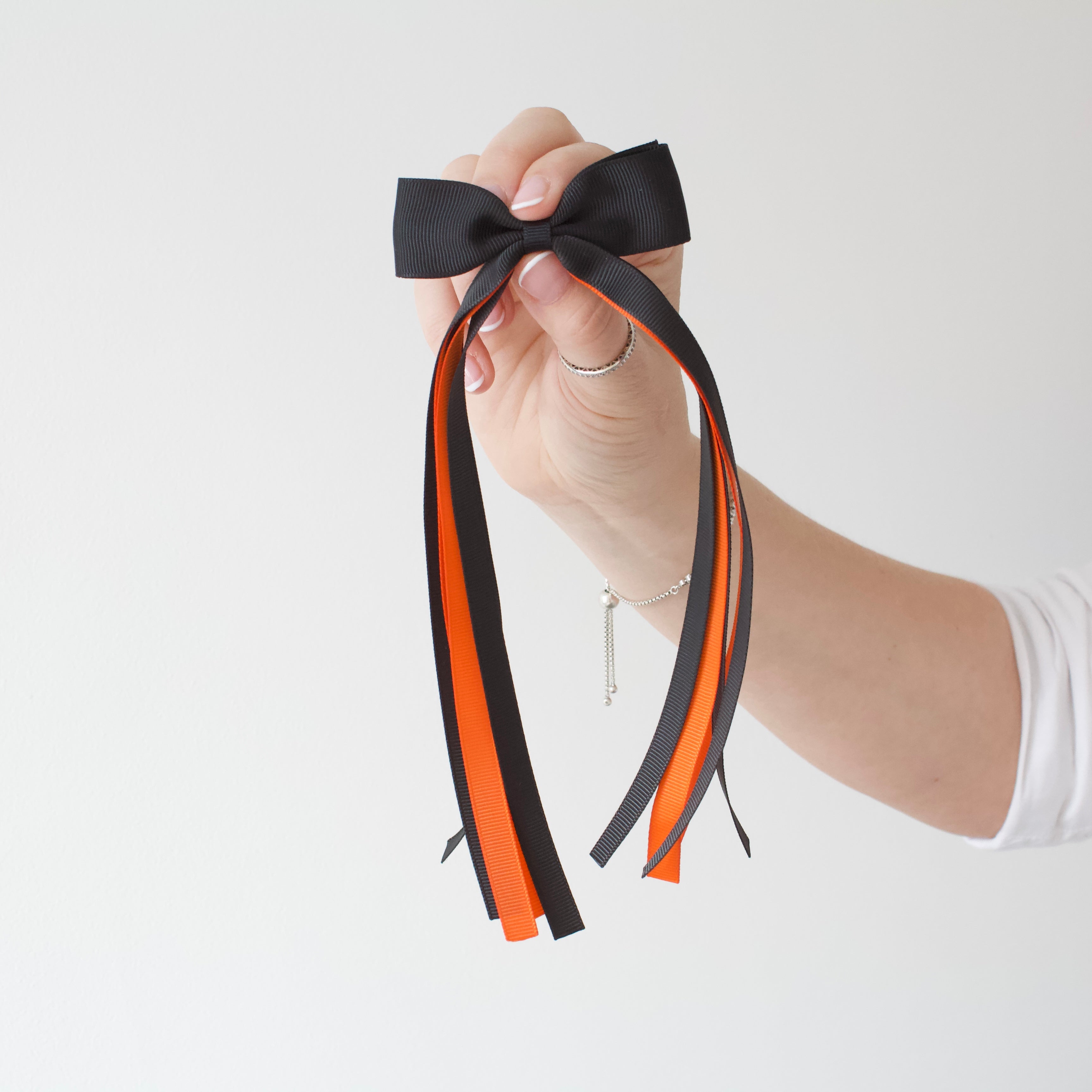 Orange and black tail pinch ribbon bow | 2 sizes