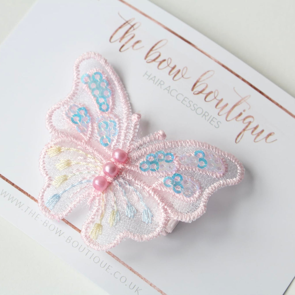 Light pink iridescent butterfly clip