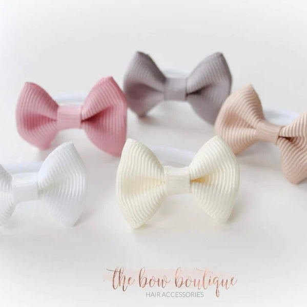 My first neutral mini pinch bows I clips or bobbles