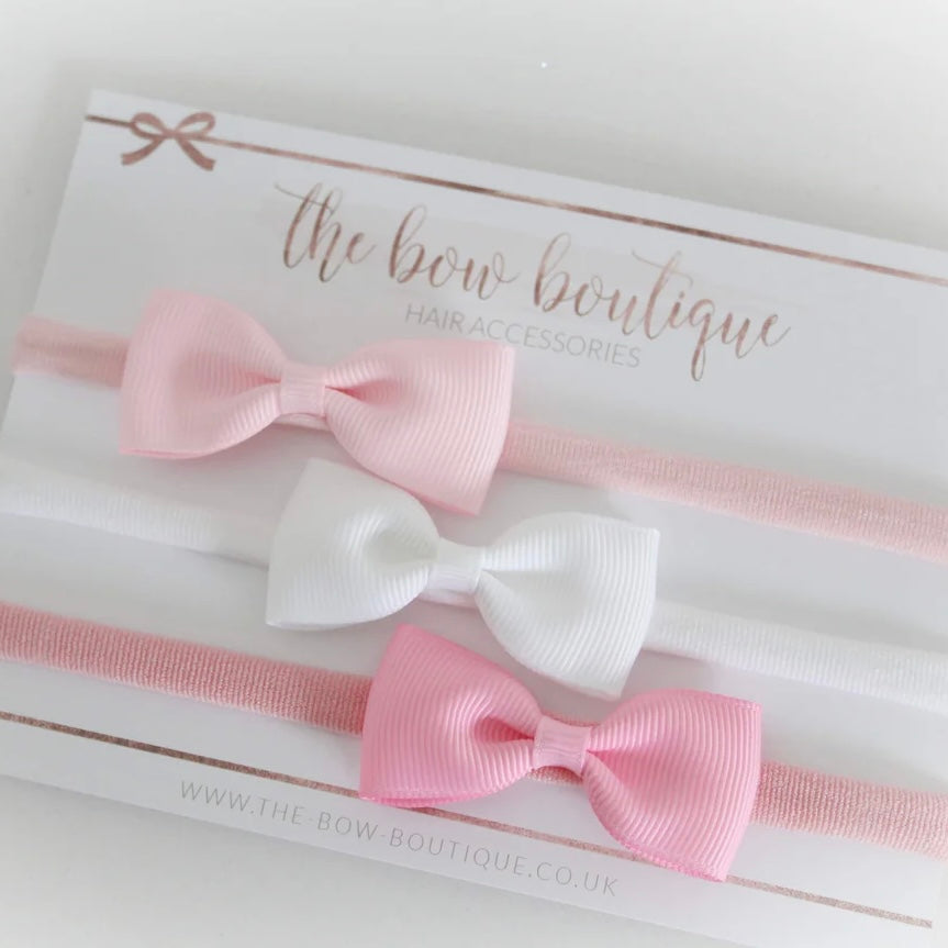 The pink pinch bow headband set