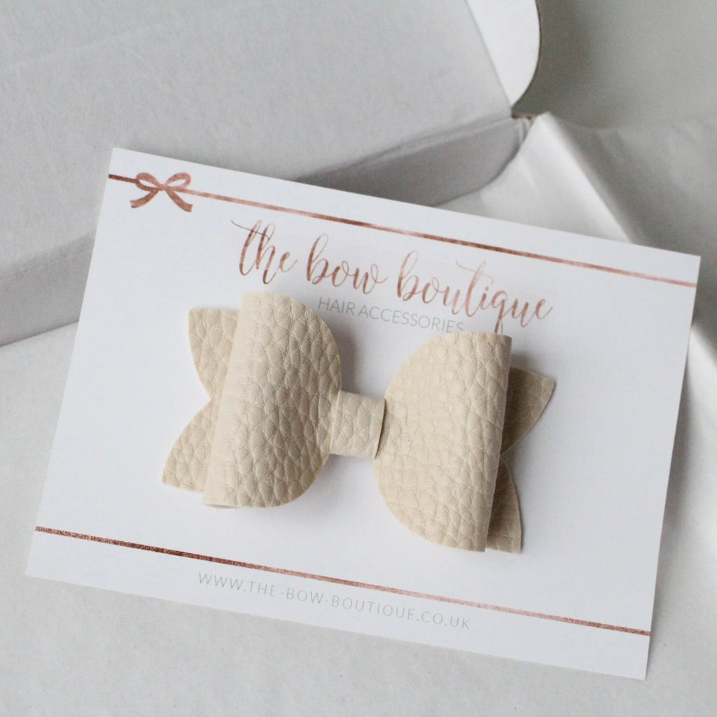 Nude leather look bows