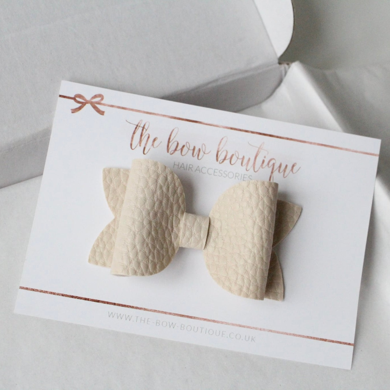 Nude leather look bows