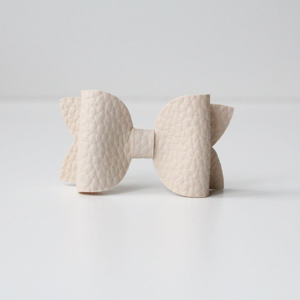 Nude leather look bows
