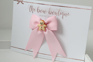 Pink gingerbread man ribbon bow