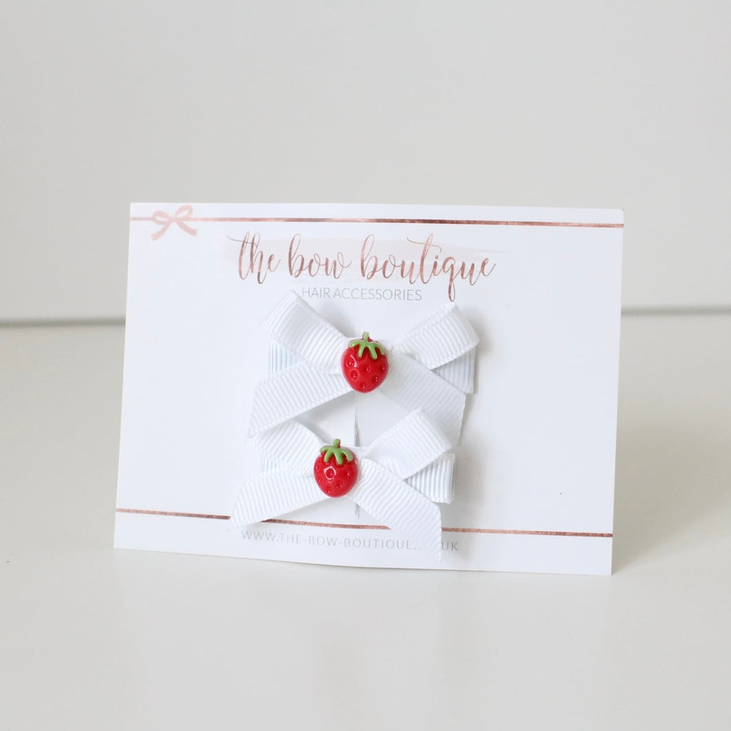 White hand tied strawberry ribbon bow clip