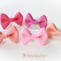 My first pink & peach mini pinch bows I clip or bobbles