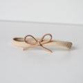 Beige mini suede bow