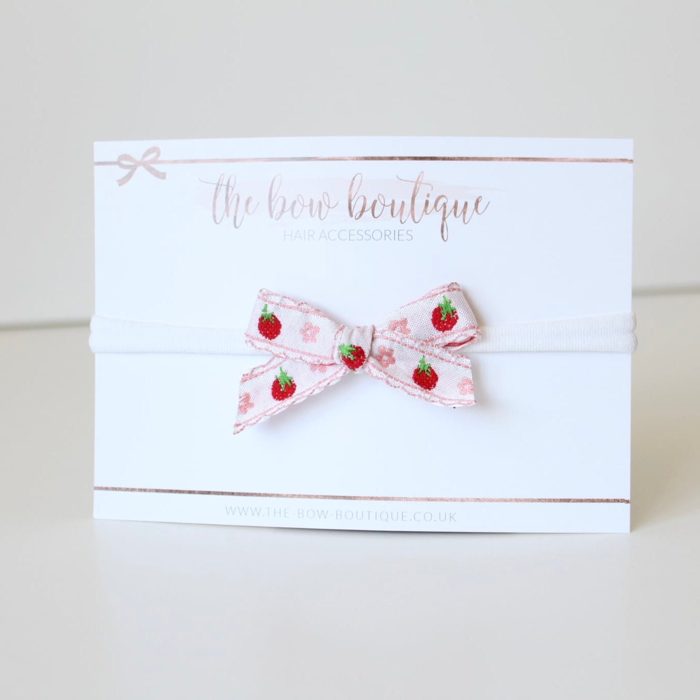 Hand tied light pink strawberry bows | Clip or headband