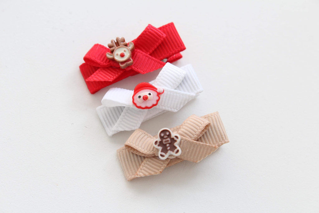 My first christmas bow clips