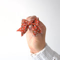 Short tail rust & blue floral bow