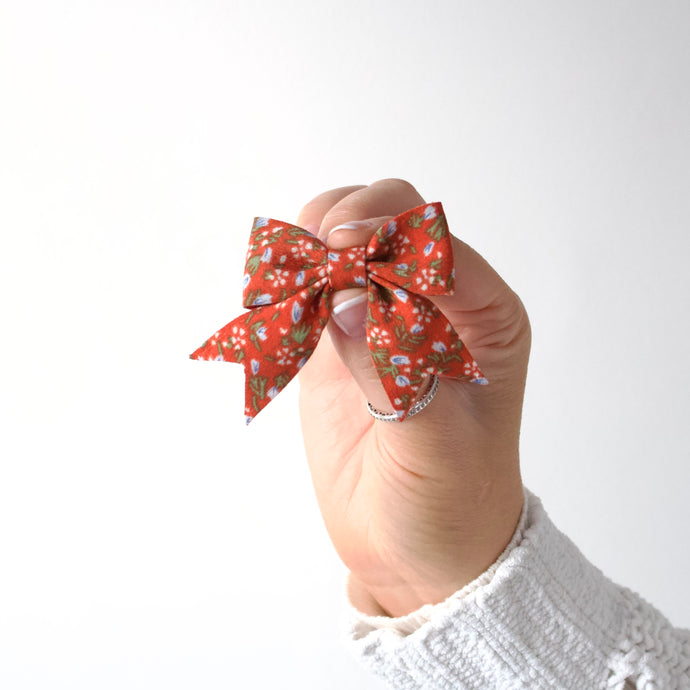 Short tail rust & blue floral bow