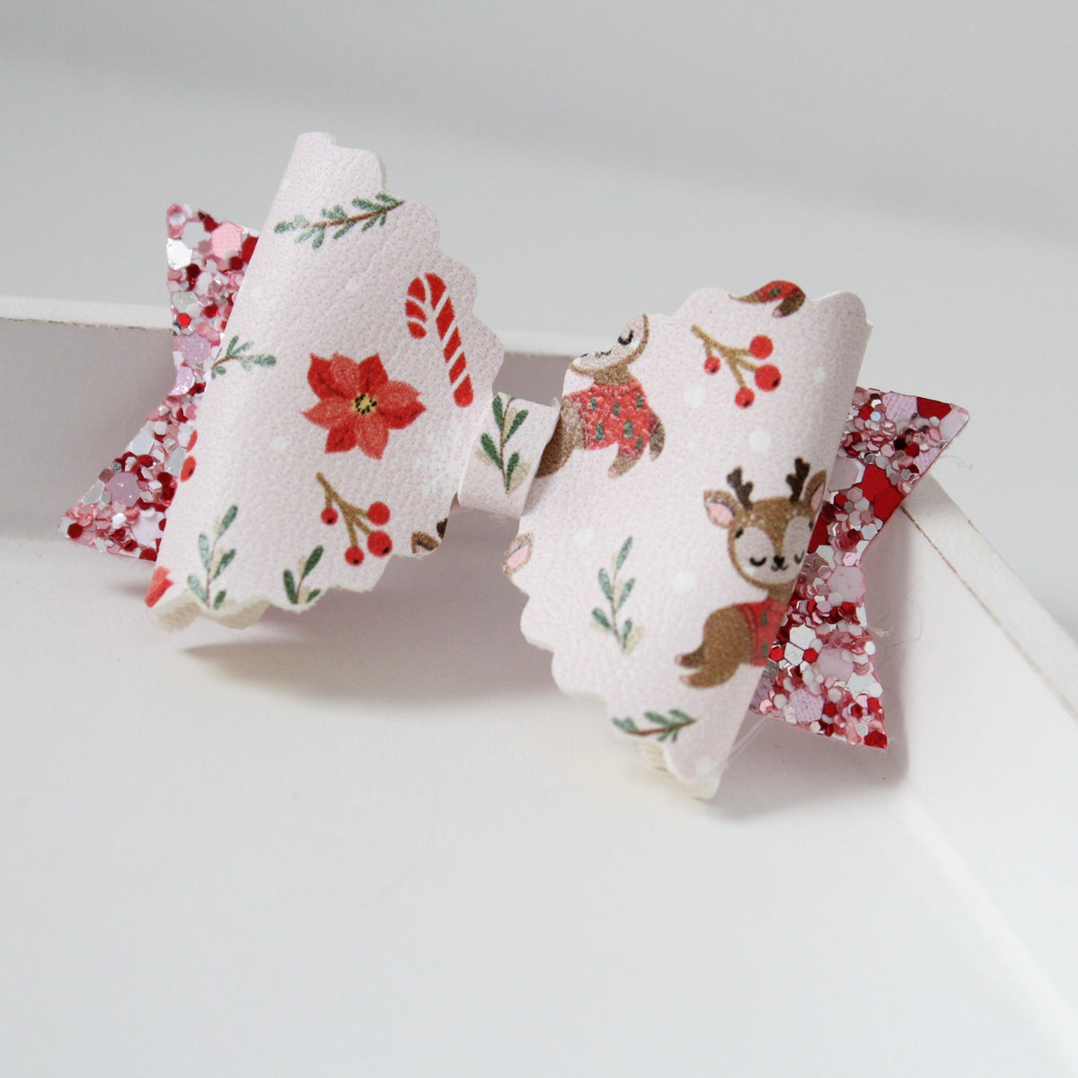 Pinkmas jolly reindeer bow | Clip or headband