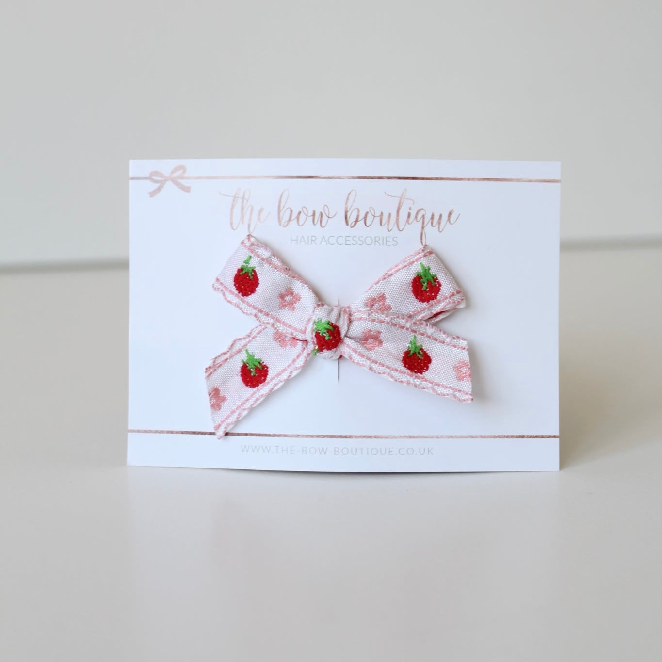 Hand tied light pink strawberry bows | Clip or headband