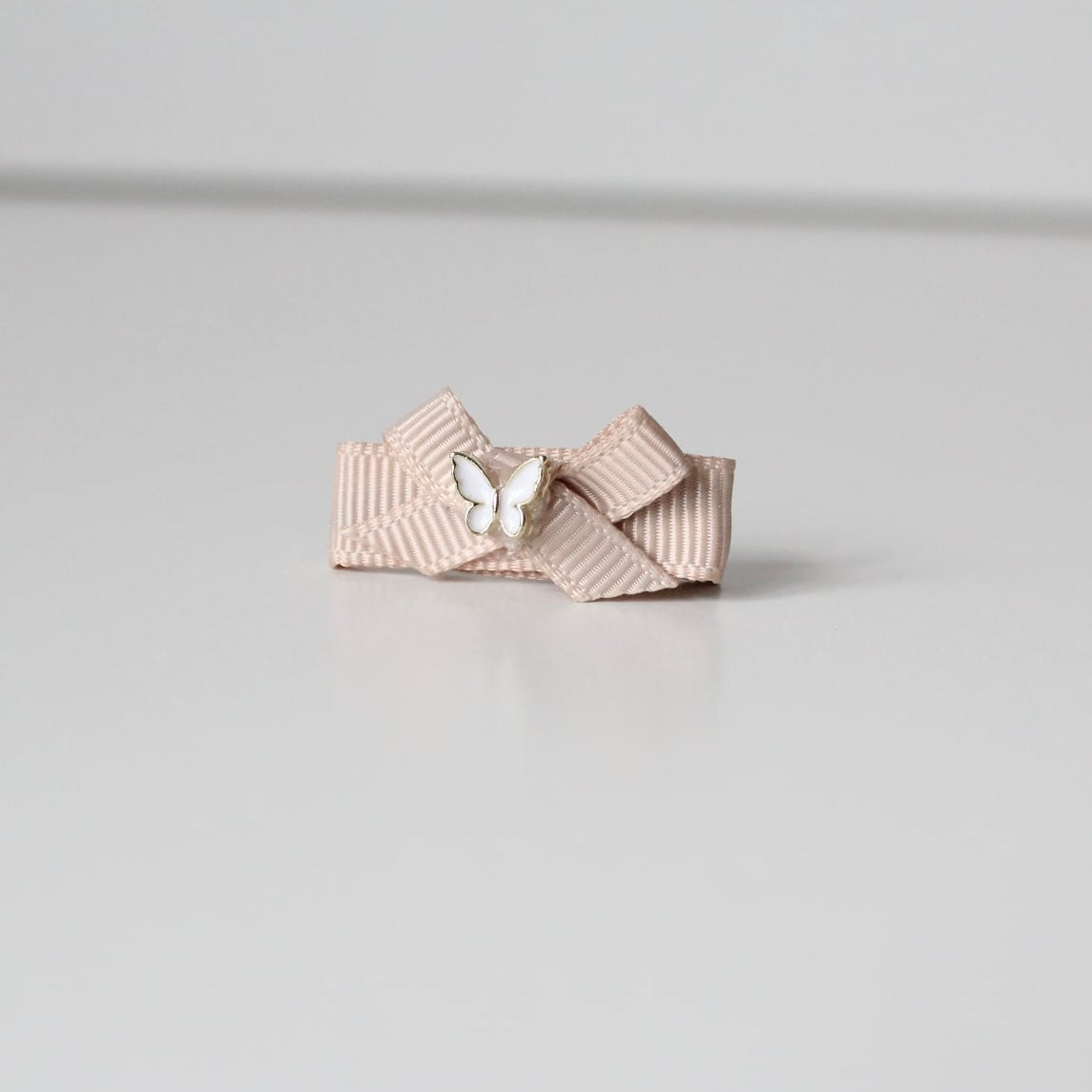 My first beige ribbon butterfly clip