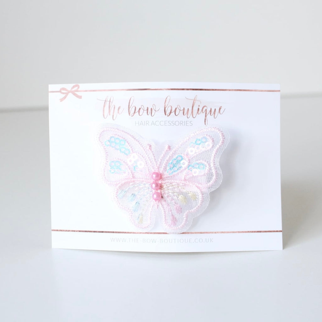 Light pink iridescent butterfly clip