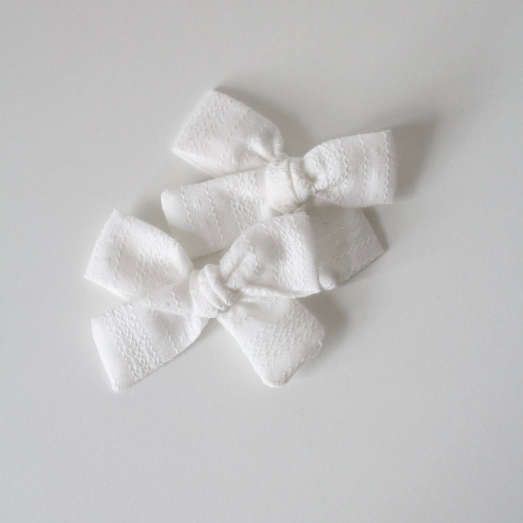 White embroidered timeless bow