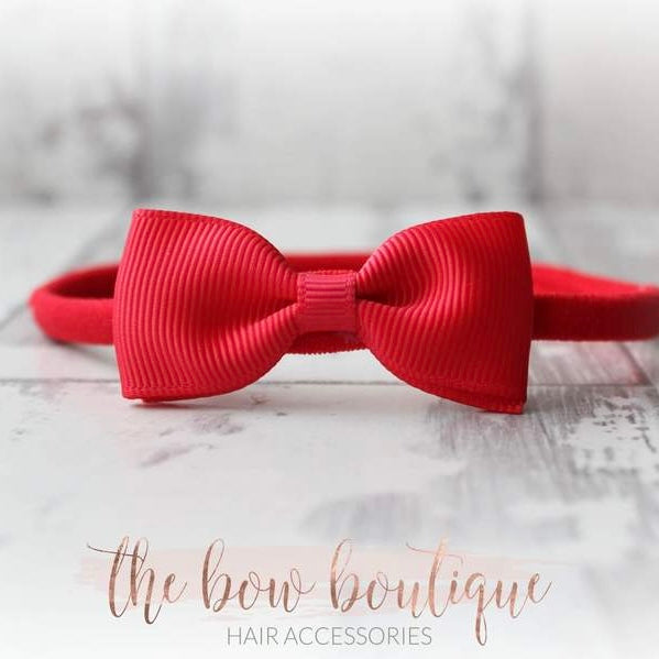 Red pinch bow nylon headband