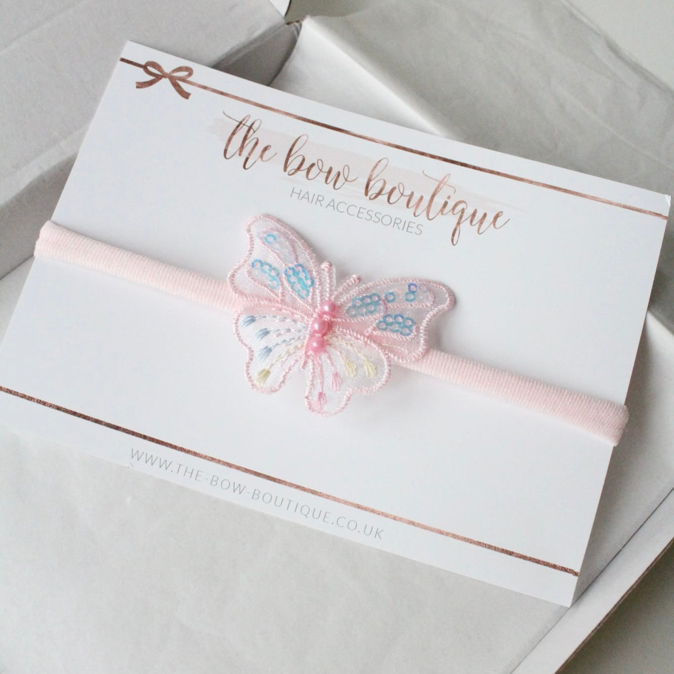 Light pink iridescent butterfly pearl headband