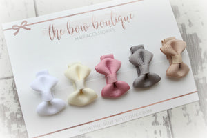 My first neutral mini pinch bows I clips or bobbles