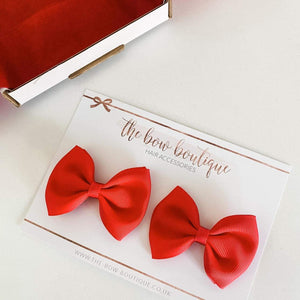 Large red pinch bows