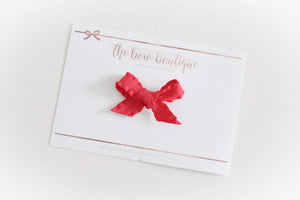 Tied ruffle red bows