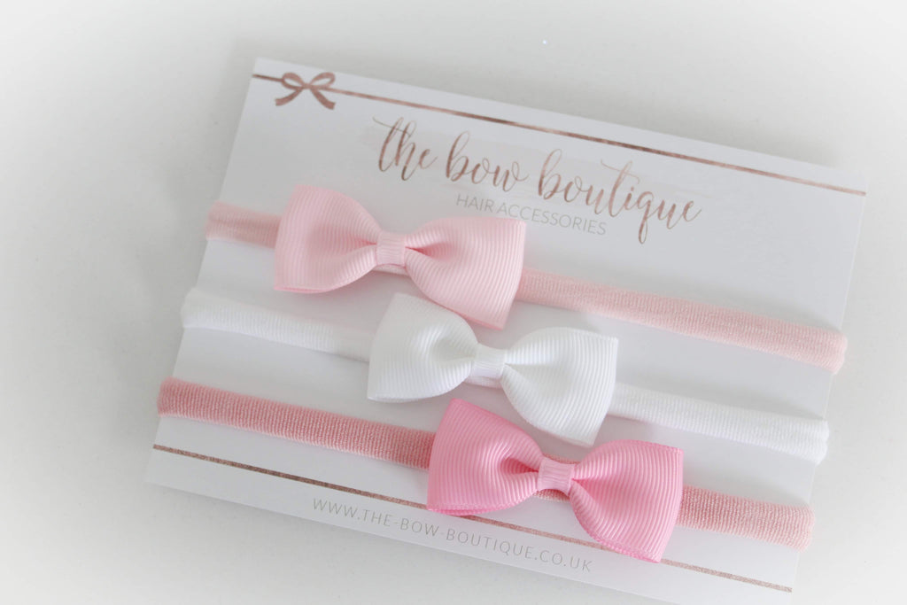 The pink pinch bow headband set
