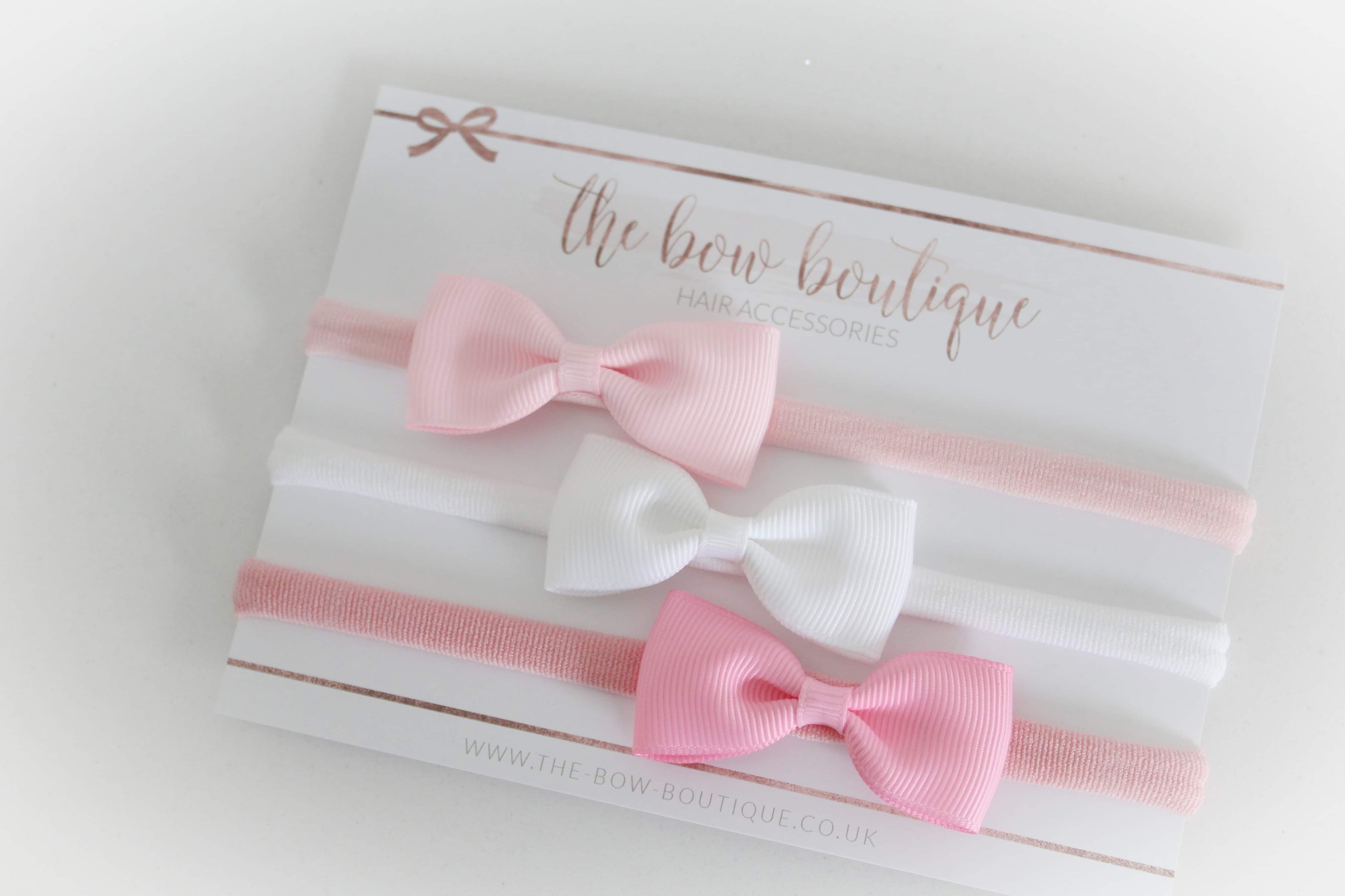 The pink pinch bow headband set