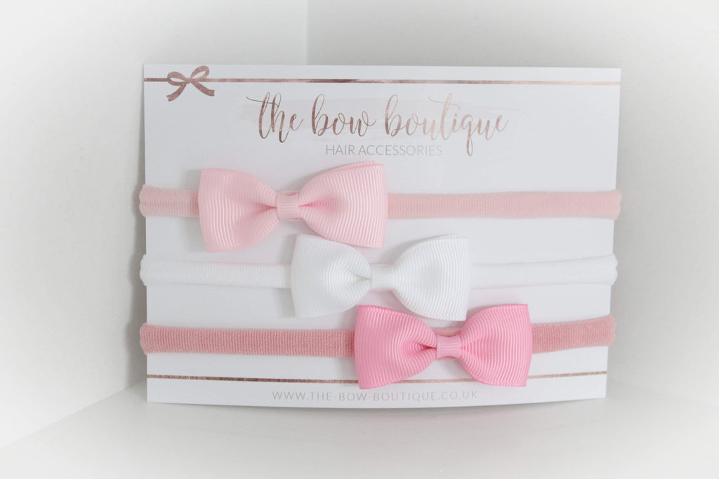 The pink pinch bow headband set