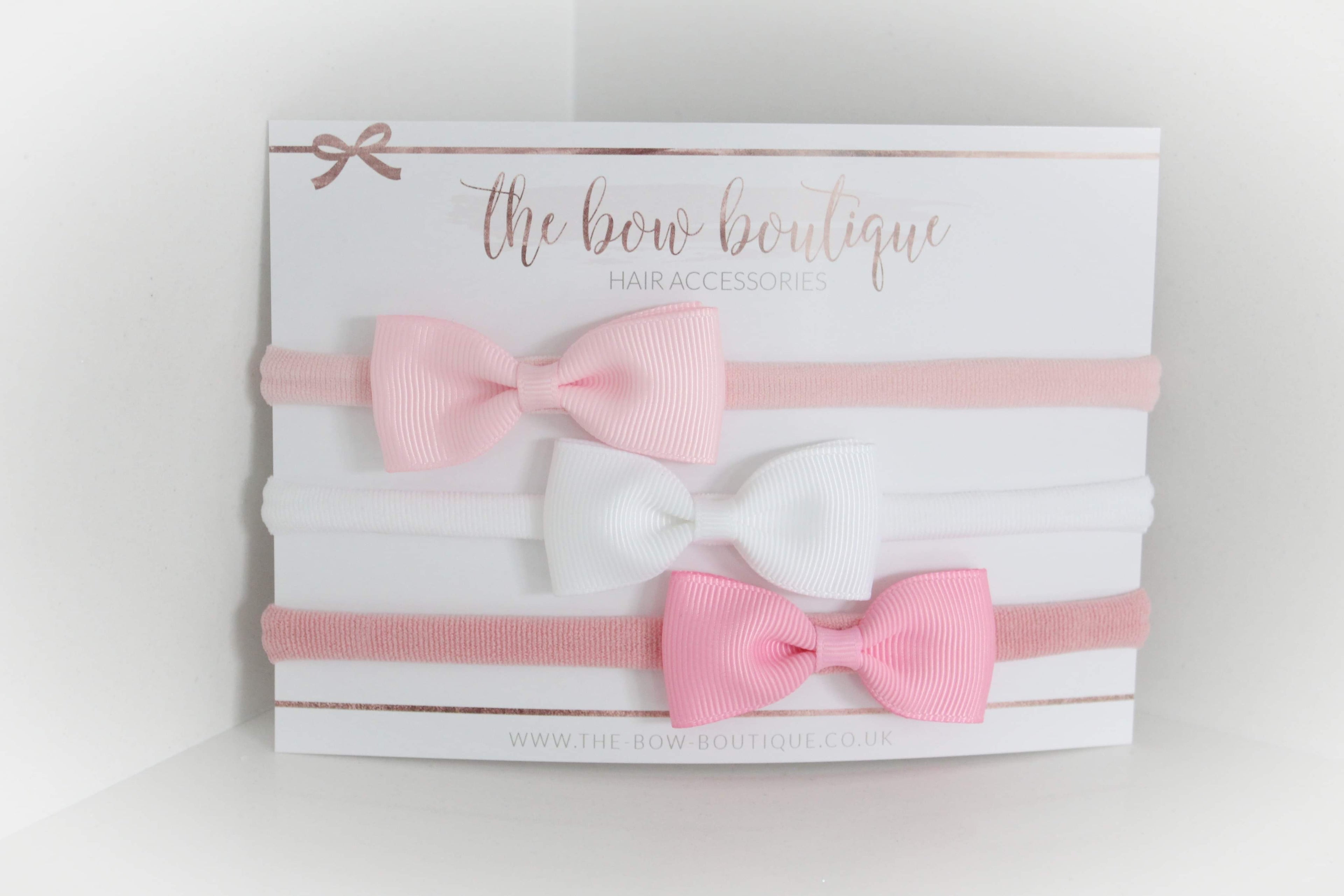 The pink pinch bow headband set