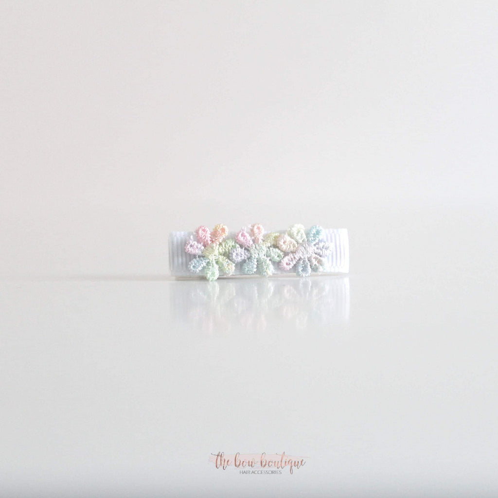 Delicate rainbow daisy flowers | Clip or headband