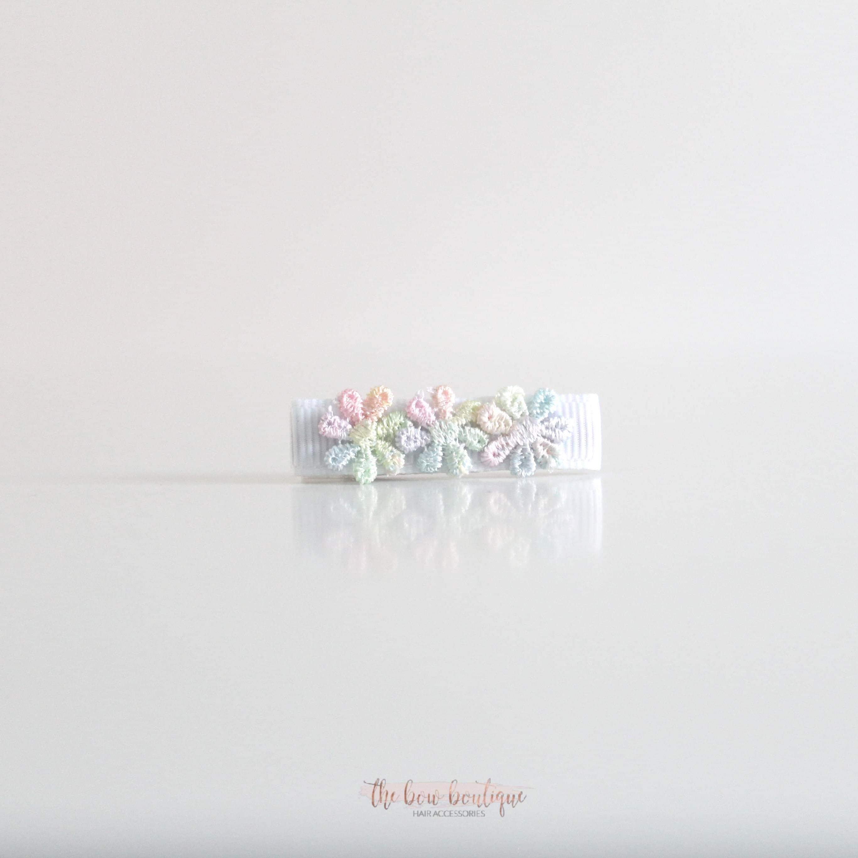 Delicate rainbow daisy flowers | Clip or headband