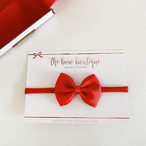 Large red pinch bows