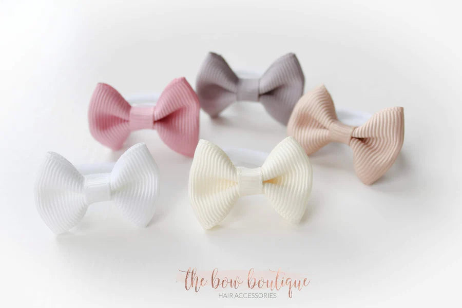 My first neutral mini pinch bows I clips or bobbles