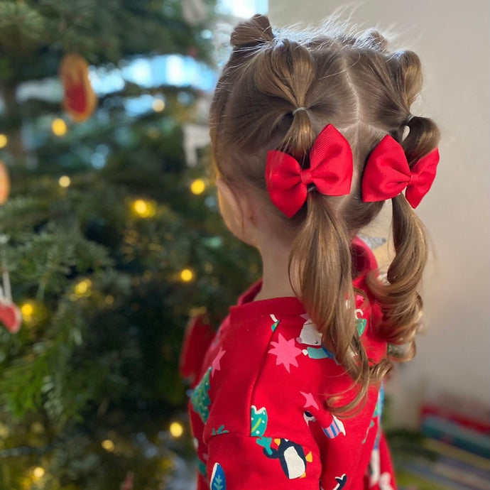 Large red pinch bows