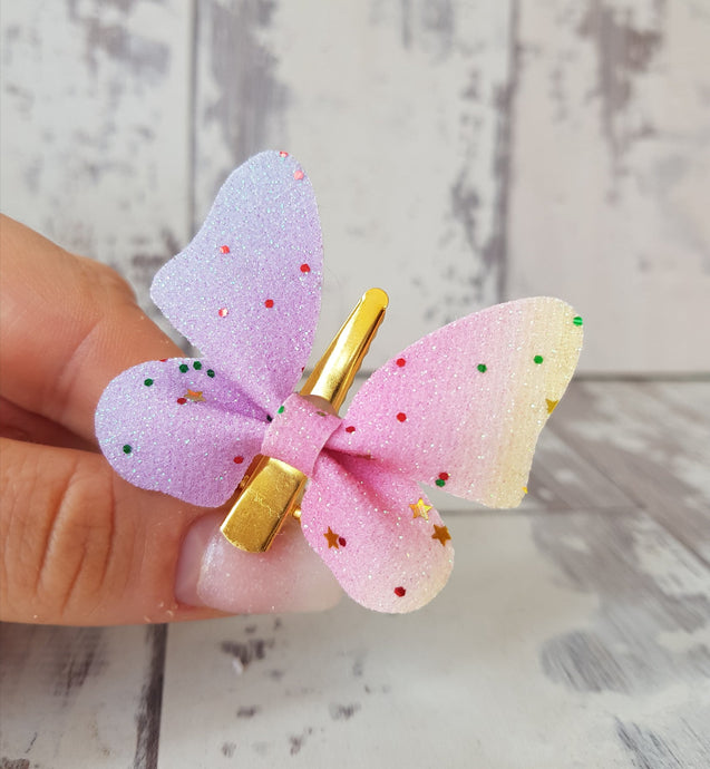 Pastel rainbow glitter butterfly.
