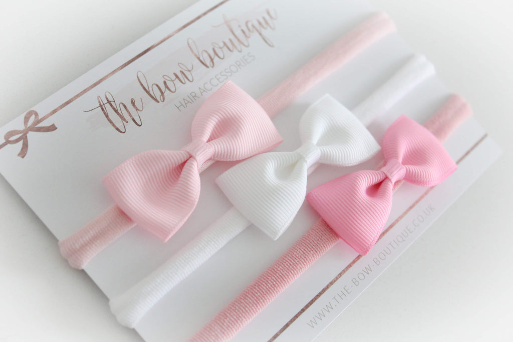 The pink pinch bow headband set