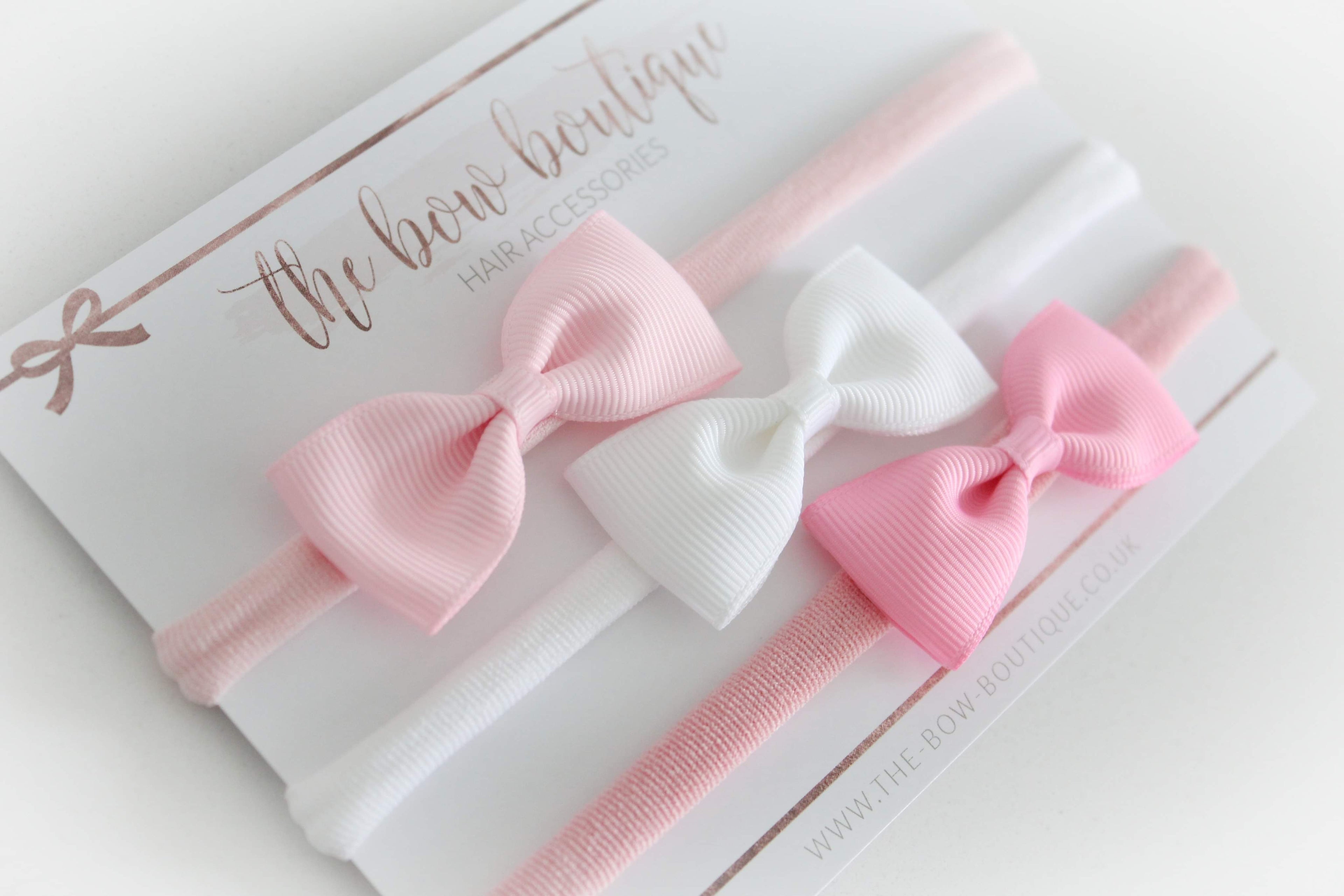 The pink pinch bow headband set