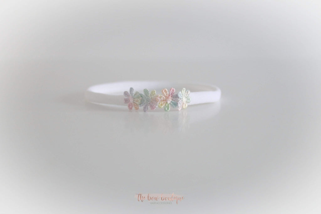 Delicate rainbow daisy flowers | Clip or headband