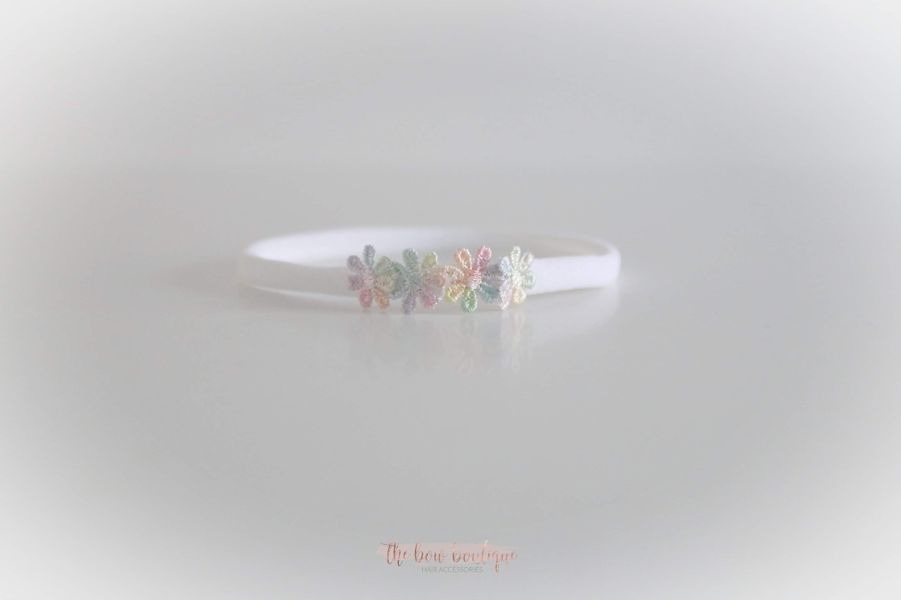 Delicate rainbow daisy flowers | Clip or headband